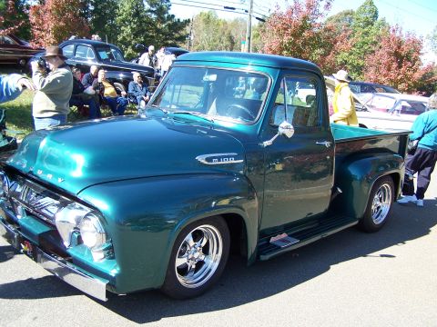 1971 Ford Ranchero - Custom 1956 Ford F-100 pickup truck at an outdoor car show.