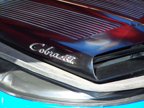 1971 Ford Ranchero - Close-up of a Cobra Jet emblem on a vehicle's hood.