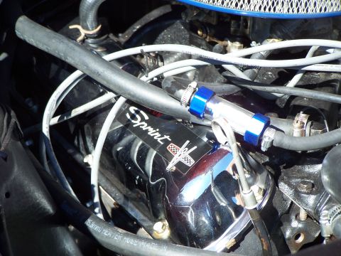 1971 Ford Ranchero - Close-up of an engine bay, focusing on a chrome valve cover with a 'Sprint' decal.