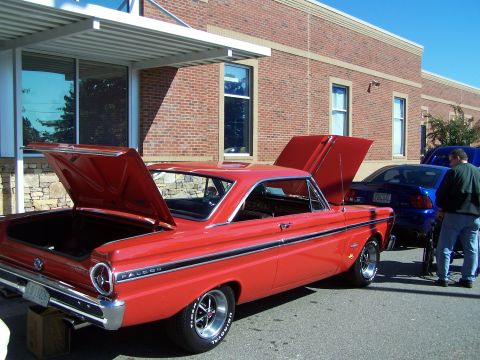 1971 Ford Ranchero - 1964 Ford Falcon with open hoods and trunk, parked outdoors next to another vehicle.