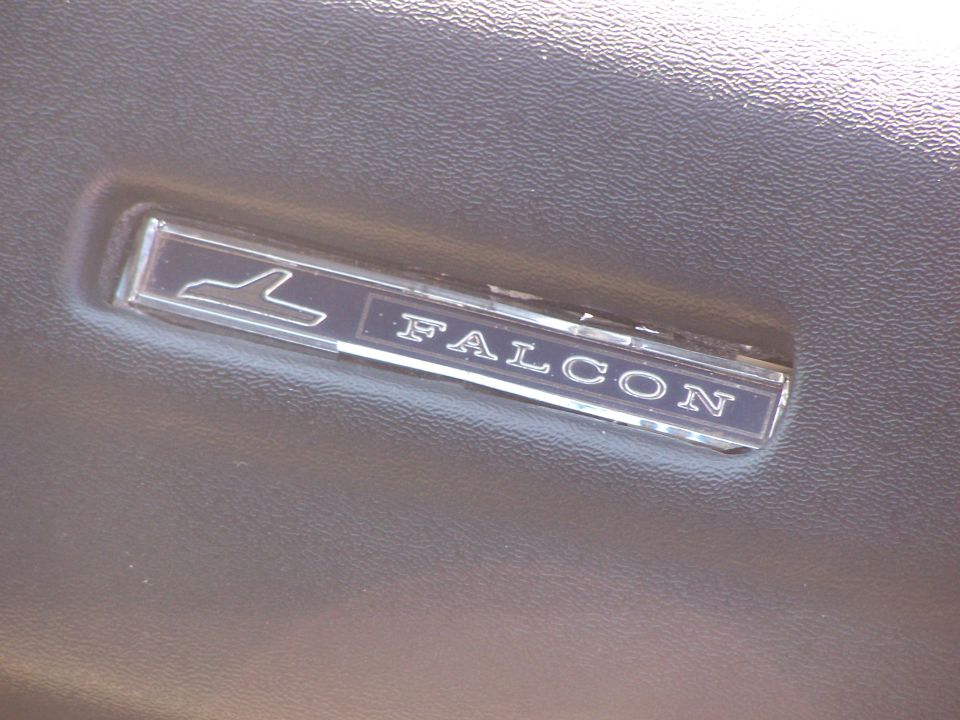 Falcon emblem on dark interior trim