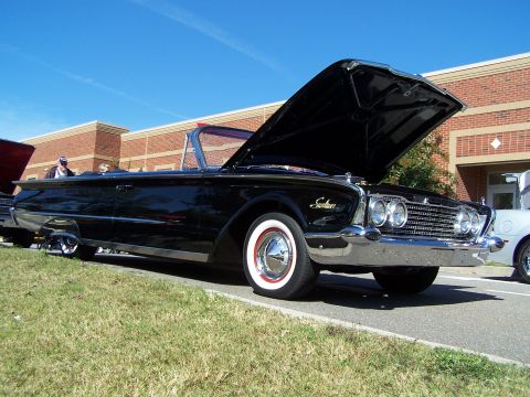 1971 Ford Ranchero - A black 1960 Ford Customline convertible is displayed with its hood open, parked outdoors on a sunny day.