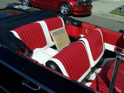 1971 Ford Ranchero - Interior view of a 1960 Ford Sunliner convertible, with a sign indicating its model and price.