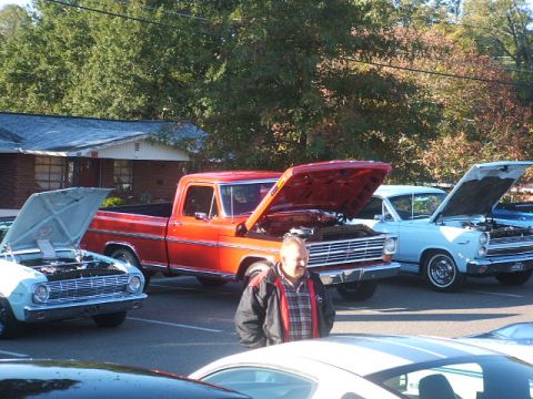 1971 Ford Ranchero - Two classic Ford vehicles, a red pickup and a blue car, displayed with hoods open at an outdoor event.