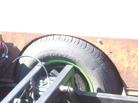 1971 Ford Ranchero - Close-up of a tire and suspension components, with visible text on the tire sidewall.