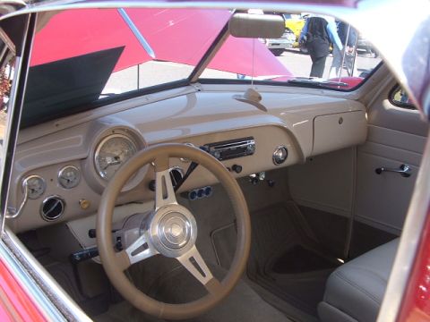 1971 Ford Ranchero - The interior of a classic car features a custom steering wheel and dashboard gauges.