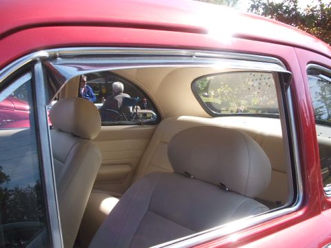 1971 Ford Ranchero - Interior view of a red vehicle, showing tan upholstery and chrome accents.
