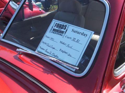 1971 Ford Ranchero - Sign inside a 1951 Ford Club Coupe at a car show lists details about the vehicle and owner.