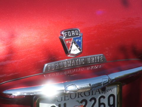 1971 Ford Ranchero - Close-up of a red vehicle's rear, showing the Ford emblem and 'Fordomatic Drive' badging.