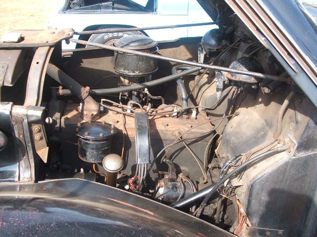 Engine bay with V8 engine, air cleaner, and wiring
