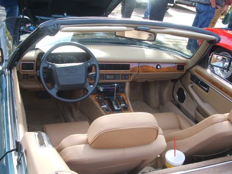 1971 Ford Ranchero - Interior view of a convertible showing tan leather seats, dashboard, and steering wheel.