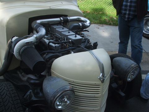 1971 Ford Ranchero - A heavily modified engine bay with a large turbocharger and custom piping is the focus of this image.