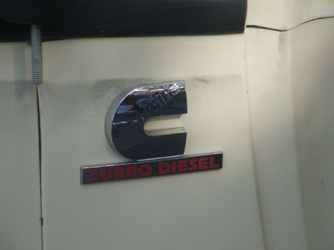 1971 Ford Ranchero - Close-up of a Cummins Turbo Diesel emblem on a vehicle's exterior panel.