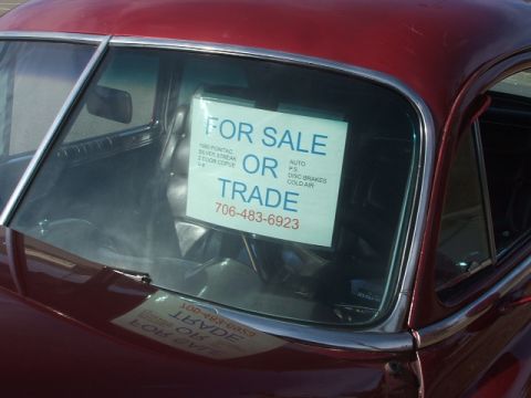 1971 Ford Ranchero - A sign in the windshield advertises a 1950 Pontiac Silver Streak for sale or trade, including contact information.