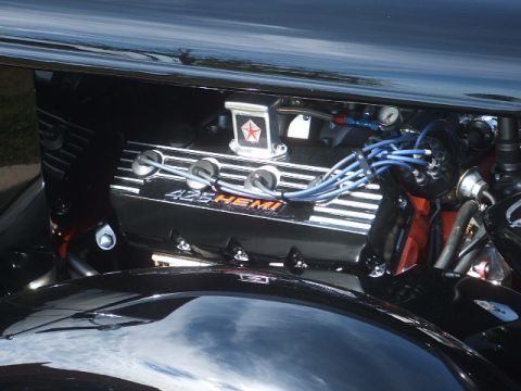 1971 Ford Ranchero - Close-up of a black 426 HEMI engine valve cover, orange lettering and blue spark plug wires.