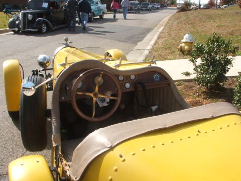 1971 Ford Ranchero - Interior view of a yellow vintage roadster, parked alongside other classic vehicles.