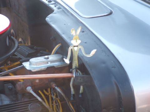 1971 Ford Ranchero - A Bugs Bunny figurine is placed in the engine bay of a vehicle, near the brake fluid reservoir.