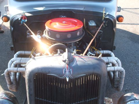 1971 Ford Ranchero - Custom hot rod engine bay with exposed exhaust headers and a prominent red air filter assembly.