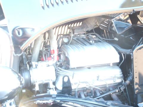 1971 Ford Ranchero - Close-up view of a V8 engine, possibly from a classic vehicle, with visible hoses and wiring.