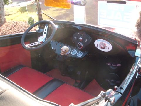 1971 Ford Ranchero - The dashboard of a modified vehicle features a skull ornament and a vintage-style steering wheel.