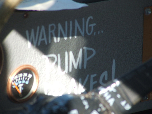 Dashboard with handwritten text 'WARNING... PUMP MAKES!' and a gauge