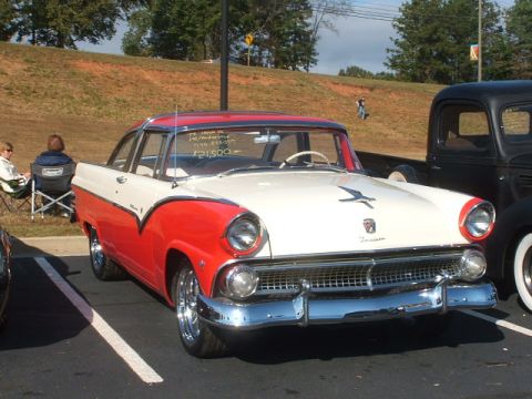 1971 Ford Ranchero - This two-tone red and white 1955 Ford Fairlane Crown Victoria coupe features a distinctive bird hood ornament and chrome grille.