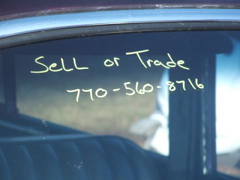 1971 Ford Ranchero - Handwritten message on a vehicle window reads 'Sell or Trade' with a phone number for inquiries.