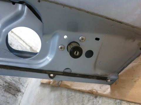 2001 Ford Crown Victoria - Close-up view of a vehicle's door lock cylinder, showing the keyhole.