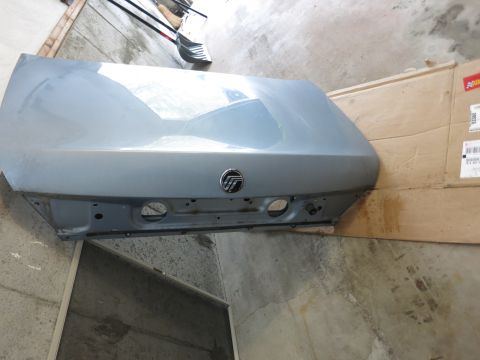 2001 Ford Crown Victoria - Trunk lid with Mercury emblem, likely from a Mercury vehicle.