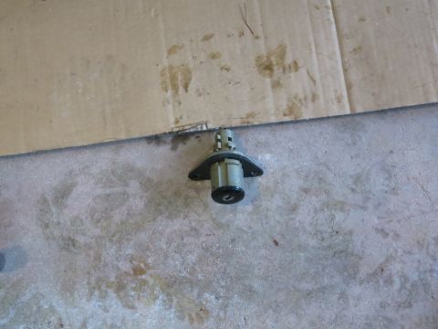 2001 Ford Crown Victoria - Ignition lock cylinder shown from the front, with a keyhole visible.
