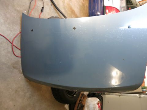 2001 Ford Crown Victoria - A blue car hood is shown, possibly for a Ford Crown Victoria, with visible mounting holes.