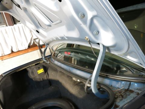 2001 Ford Crown Victoria - The interior of a car's trunk is visible with the lid open, revealing the spare tire and surrounding components.