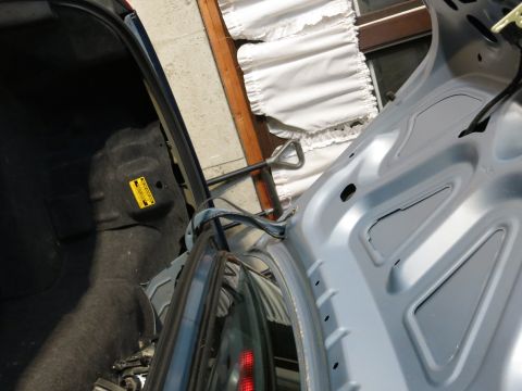 2001 Ford Crown Victoria - Interior view of a car's trunk, showing carpeting and metal structure.