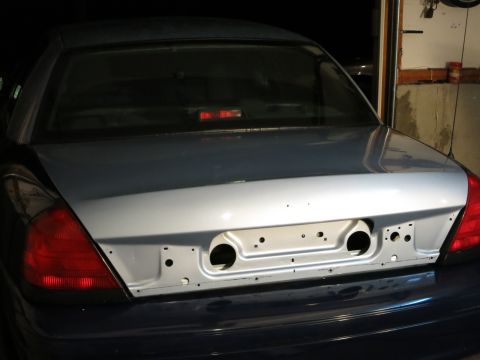 2001 Ford Crown Victoria - Rear view of a 2001 Ford Crown Victoria showing the trunk area and taillights.
