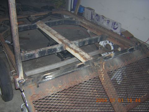 1984 Chevrolet Blazer - This photo shows the frame of a trailer being worked on, with visible rust and welding marks.
