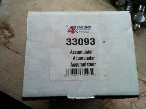 2007 Ford Crown Victoria - Box for a 33093 Accumulator part from 4 Seasons, with part number and barcode visible.