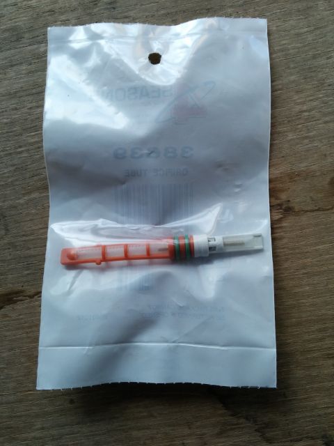 2007 Ford Crown Victoria - A desiccant filter part, likely for an automotive AC system, is shown in its packaging.