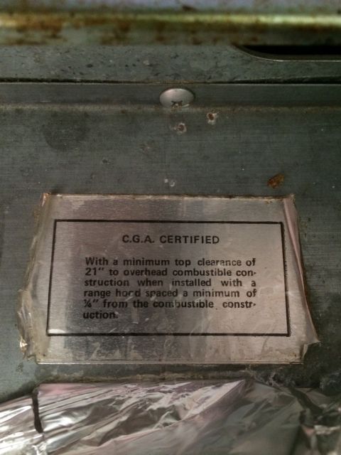 1997 Dodge 3500 - A close-up of a metal label detailing safety clearances for installation.