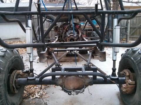 1986 Ford Bronco - Custom off-road buggy chassis is shown from the rear, its engine and suspension setup.