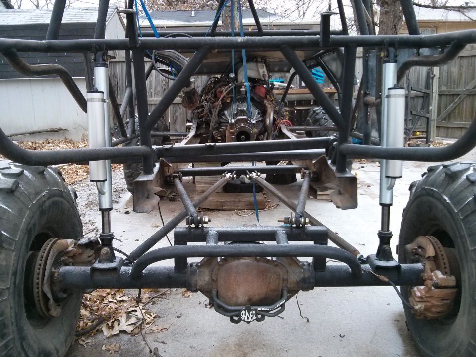 Off-road buggy chassis rear view with engine and suspension components