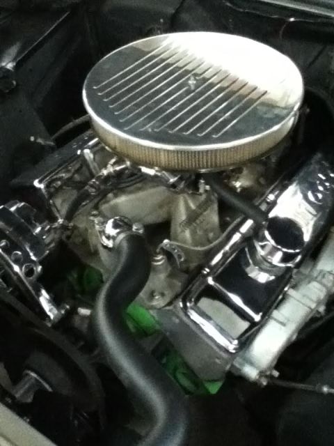 1963 Chevrolet Nova - Engine bay details with chrome accents, including the air cleaner and valve covers. A Supermotors.net logo is present in the lower right co…