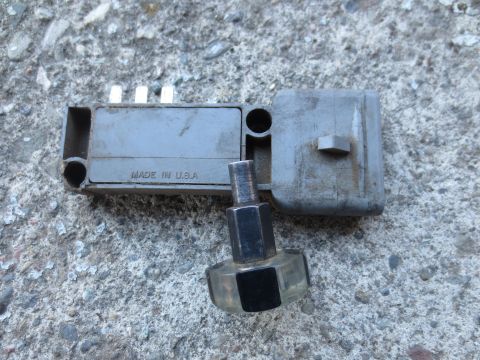 1946 Jeep Willys - This automotive part, labeled "MADE IN U.S.A.", is shown on a rough concrete surface.
