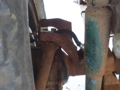 1946 Jeep Willys - Close-up view of a wheel cylinder and brake hose, part of a vehicle's braking system.