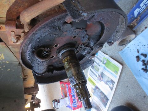 1946 Jeep Willys - A close-up view of a heavily corroded wheel cylinder and brake drum assembly, showing signs of wear and tear.