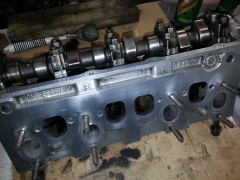 2002 Volkswagen Jetta - Close-up of an engine cylinder head, showing the camshaft and "VWWO GERMANY" markings.