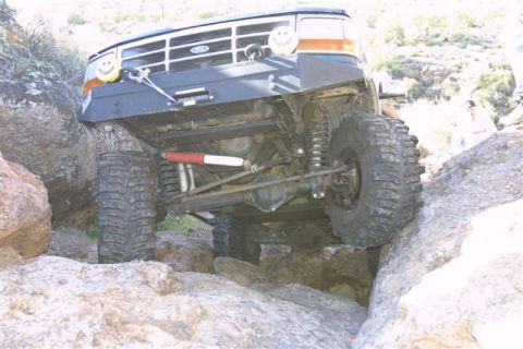 1994 Ford Bronco - Modified Ford Bronco tackling a challenging rock crawl.