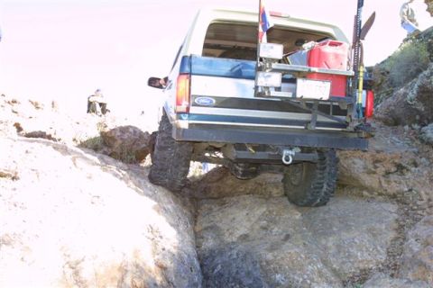 1994 Ford Bronco - This 1994 Ford Bronco is navigating a rocky trail, demonstrating its off-road capability.
