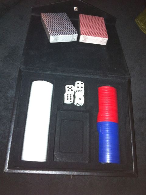 1984 BMW 3 Series - This poker set includes two decks of cards, four dice, and red and blue chips inside a black case.