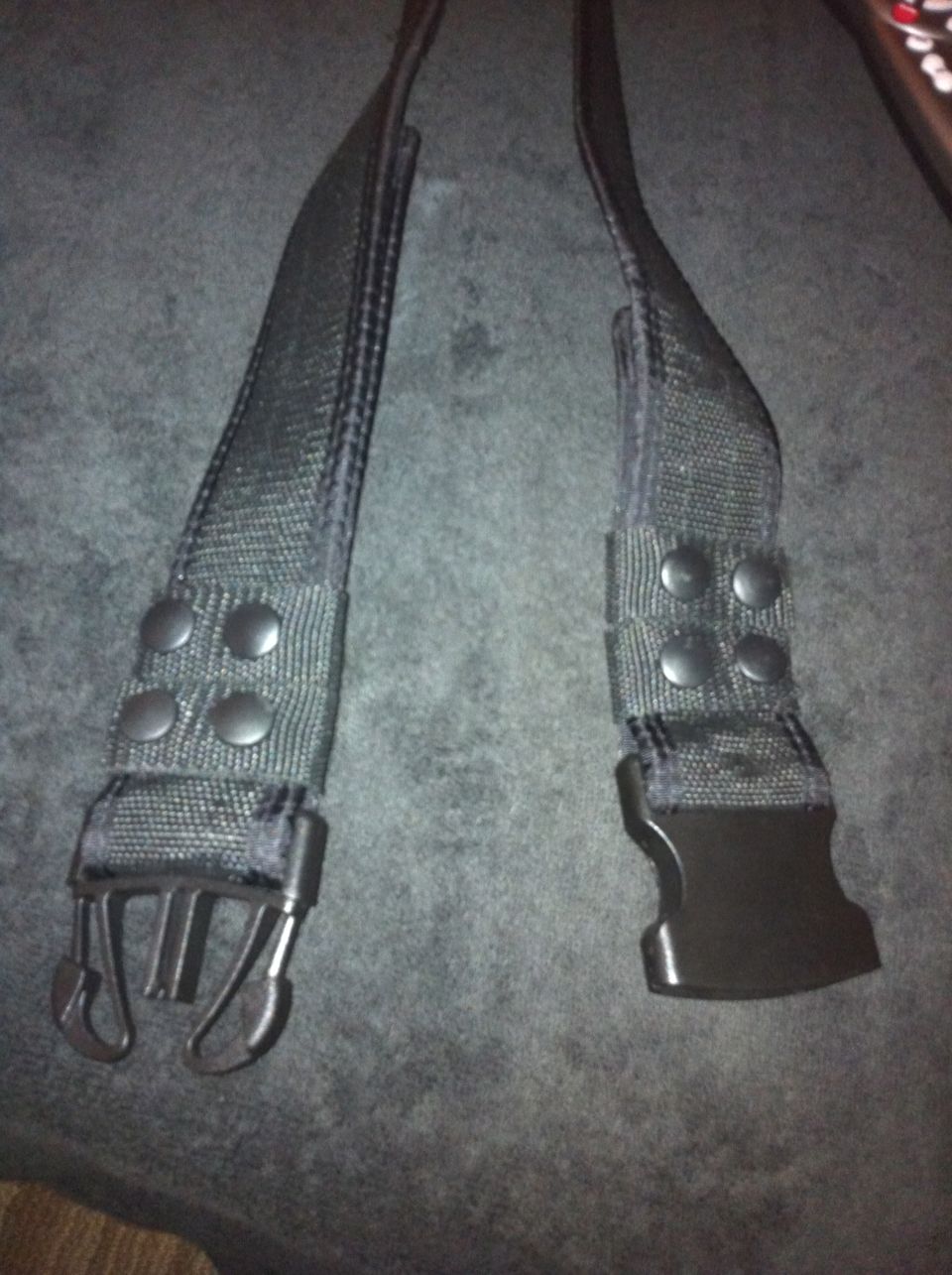 Black seatbelt buckle and strap with metal clips