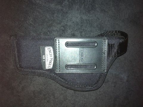 1984 BMW 3 Series - This is a black nylon gun holster from Uncle Mike's, size 1.